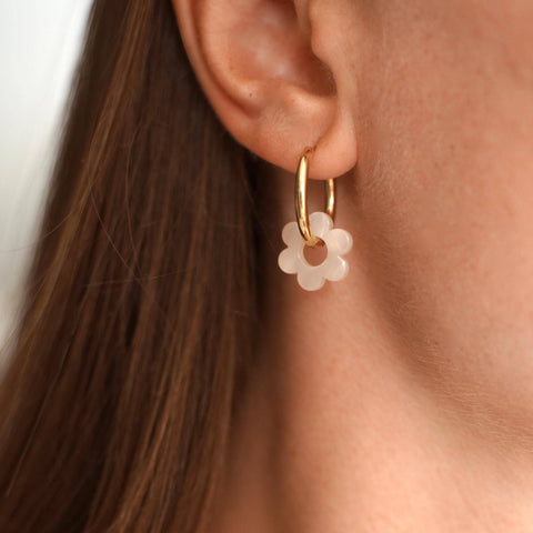 Small stainless steel hoop earrings with white flower