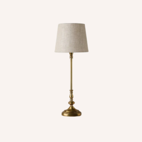 Antique Oval Lamp Base styled in a room setting, gold finish
