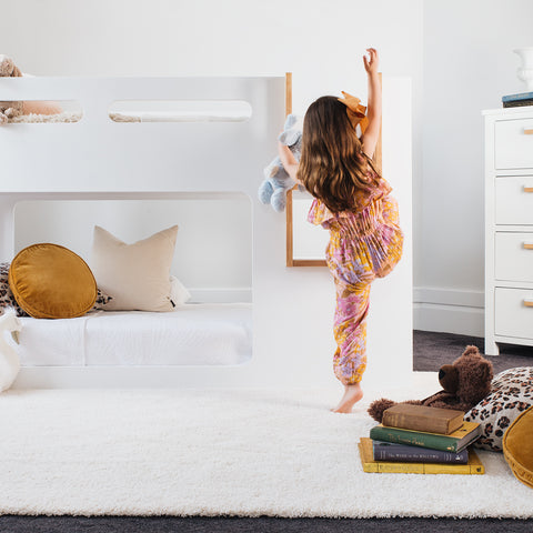 Atlas bunk bed styled in a child's bedroom with linen bedding