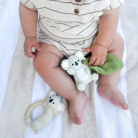 Baby holding Banks the Koala natural rubber teether