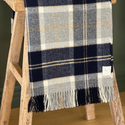 Bannochburn Silver Merino Throw styled over a stool