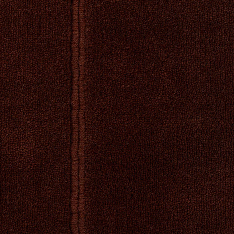 Close-up of Bastion Claret Rug stitched seam detail