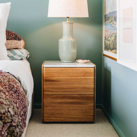 Betty bedside tables Natural Oak with marble top styled in a bedroom