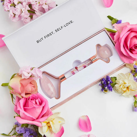 Bopo Facial Roller in Rose Quartz styled with flowers