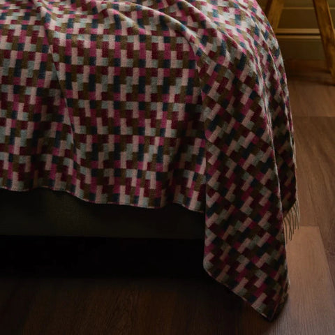 Bricks Pink & Khaki Merino Throw styled on a bed