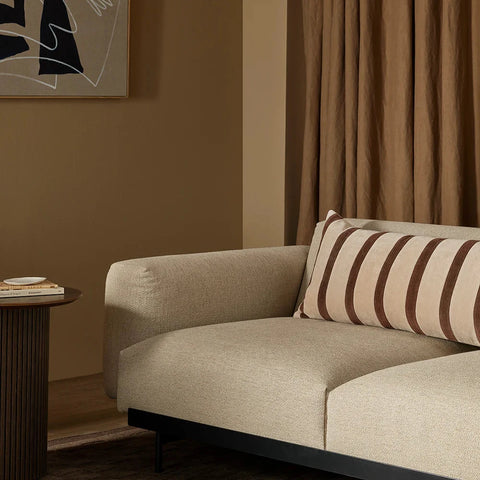 Chocolate and tan striped cotton velvet and corduroy lumbar cushion on a linen sofa