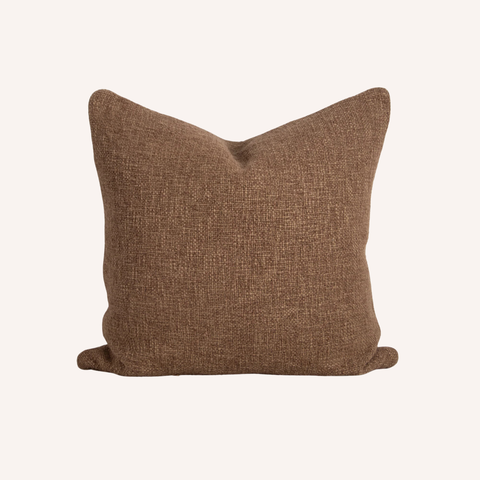 Close-up of brown cushion's handwoven texture