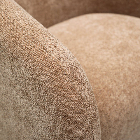 Close-up of caramel textured polyester fabric on the Ted swivel chair