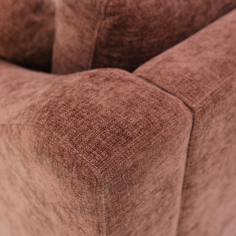Close-up of feather and fibre cushion fill and rust upholstery on the Ember sofa