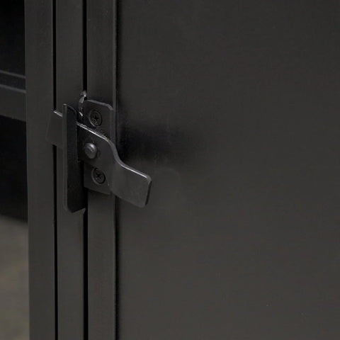 Close-up of framed glass door and latch closure on the Kingston metal sideboard