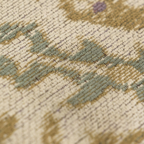 Close-up of geometric pattern and distressed finish on the Little Flame rug
