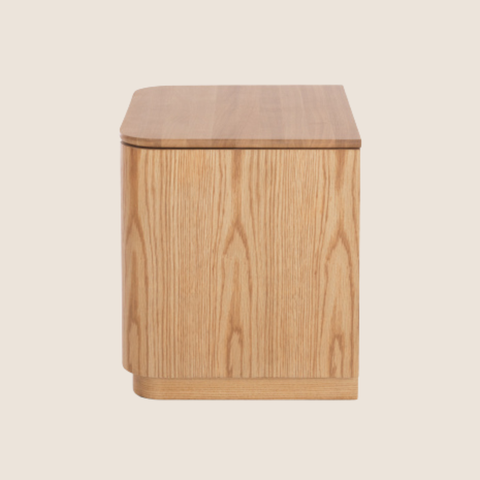 Close-up of oak grain and curved edge detail on the Linden bedside table