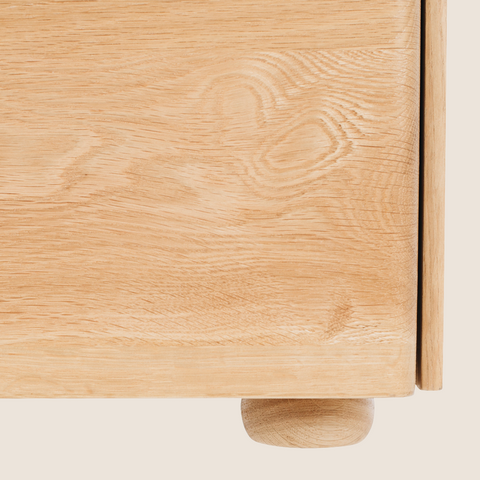 Close-up of oak grain and marble top detail on the Betty bedside table