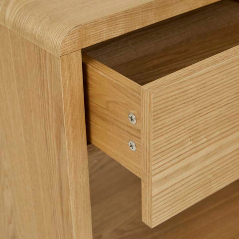 Close-up of oak veneer grain and drawer detail on the Jocelyn bedside table