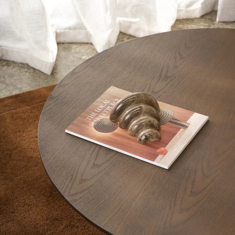 Close-up of oak veneer grain and rounded edge detail on the Nova coffee table