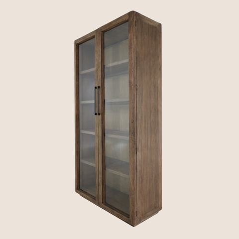 Close-up of reclaimed elm grain and walnut brown wax finish on glass cabinet