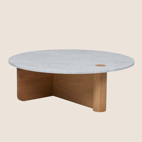 Close-up of veined marble top on the Pivot coffee table, natural oak base