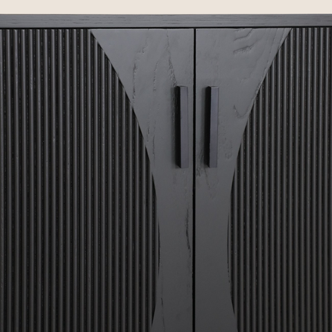 Close-up of vertical fluting detail and rounded corners on black oak sideboard