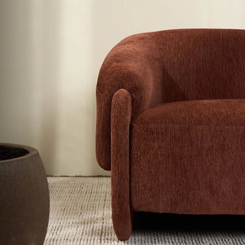 Detail view of the Haven Armchair's polyester upholstery and timber frame