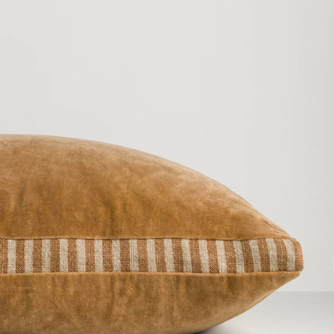 Side profile of Edward Butterscotch Cushion showing striped linen gusset detail