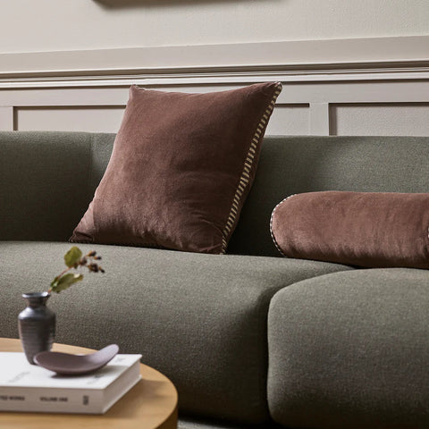 Edward Chocolate cotton velvet box cushion with striped linen gusset, styled on a sofa