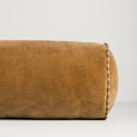 Close-up of Elliot Butterscotch Bolster Cushion showing cotton velvet texture and striped linen piping