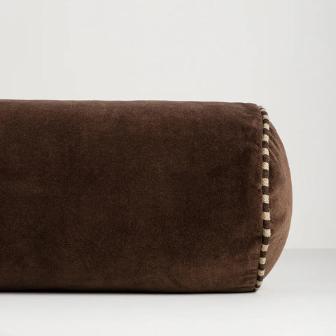 Close-up of Elliot Chocolate Bolster Cushion showing cotton velvet texture and striped linen piping