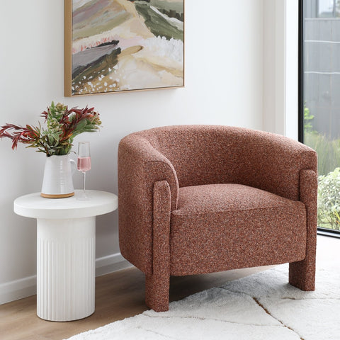 Ember Chair in rust boucle fabric, curved silhouette, front view