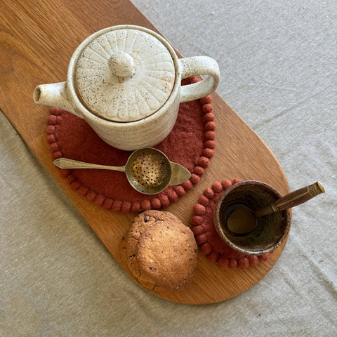 Felt_trivet_styled_with_tea pot and biscuits_natural_home_decor_gift_idea