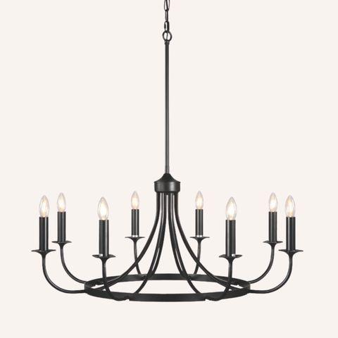 A nine-light black metal chandelier with candle-style bulbs, suspended from a chain against a solid off-white background.