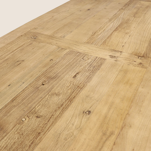 Gia reclaimed elm dining table close-up showing natural grain and knot detail