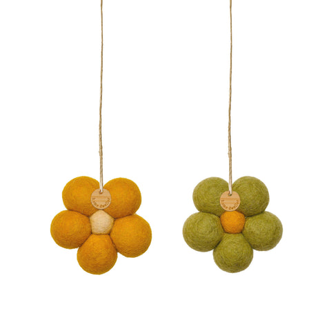 Handcrafted wool flower in earthy green tones, close-up detail