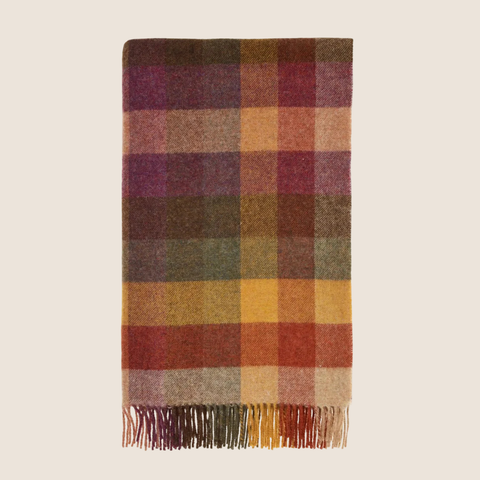 Harlequin Autumn NZ Wool Throw folded flat on white background