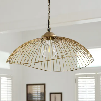 Havana Pendant styled in a room setting, antique brass finish