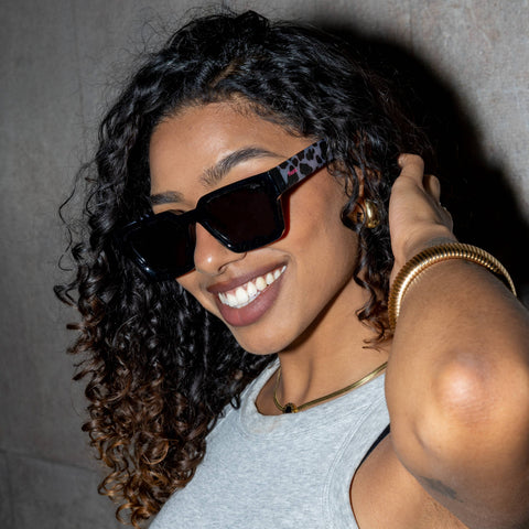 "Holy Cow" sunglasses styled on a model