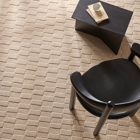 Hugo Almond rug close-up showing hand-carved checkerboard pile depth