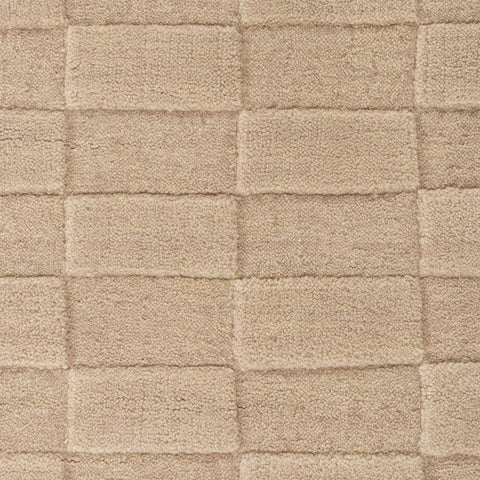 Hugo Almond rug corner detail showing soft warm tone and wool texture