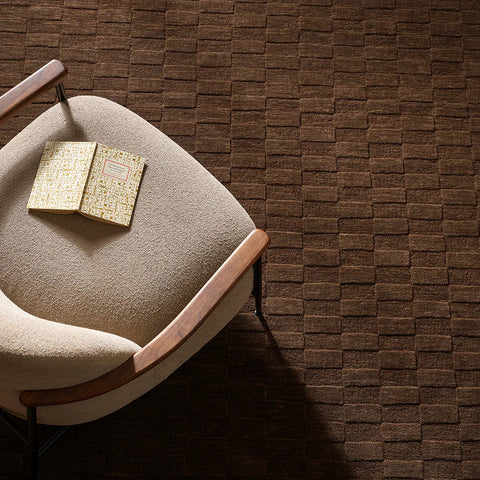 Hugo Espresso rug close-up showing hand-carved checkerboard pile depth