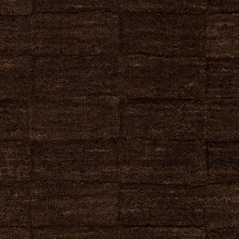 Hugo Espresso rug corner detail showing deep espresso tone and wool texture