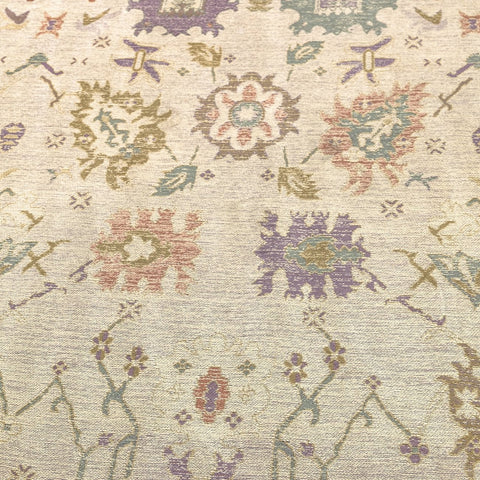 Little Flame rug colour palette close-up — dusty rose, olive, and muted clay
