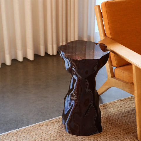 Lulu Noise amber gloss recycled plastic side table with wavy surface texture, studio shot