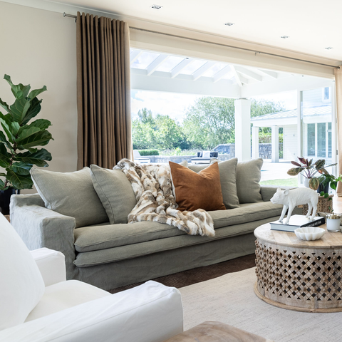 Luxury Lodge slipcover sofa in Cement, styled in a living room setting
