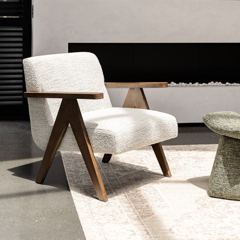 Madison armchair upholstered in polyester, lifestyle shot in a contemporary interior