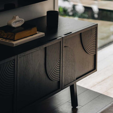 Modern Ritual TV Unit Black styled in a living room with TV above
