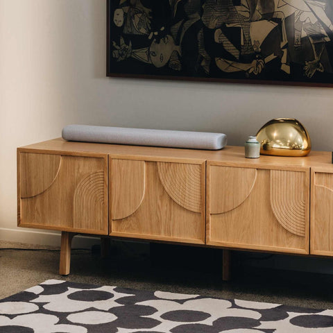Modern Ritual TV Unit in Natural oak with circular panel doors, front view