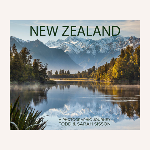 NZ: A Photographic Journey book cover featuring New Zealand landscape photography