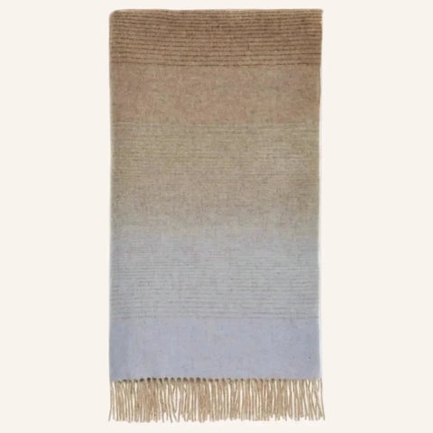 Ombré Stripe Navy & Rust Merino Throw folded flat on white background