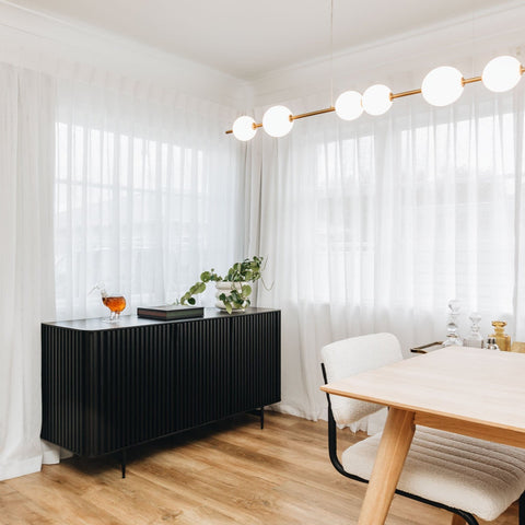 Pete Sideboard in Black, styled in a living room setting