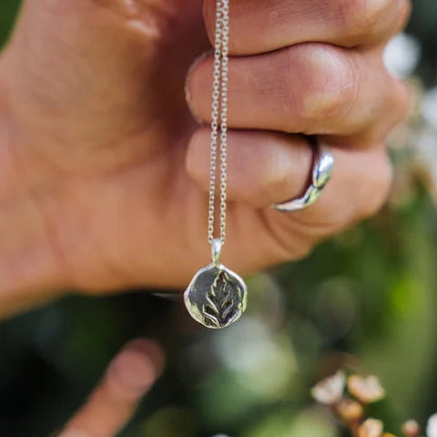 Sterling silver pendant cast from a pressed silver fern frond