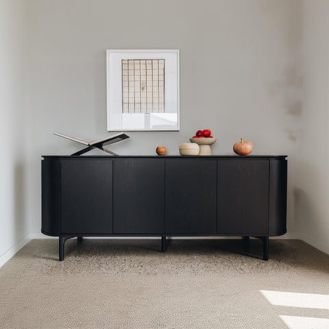 Studio Curve Sideboard in Black, front view showing curved profile and notch handles